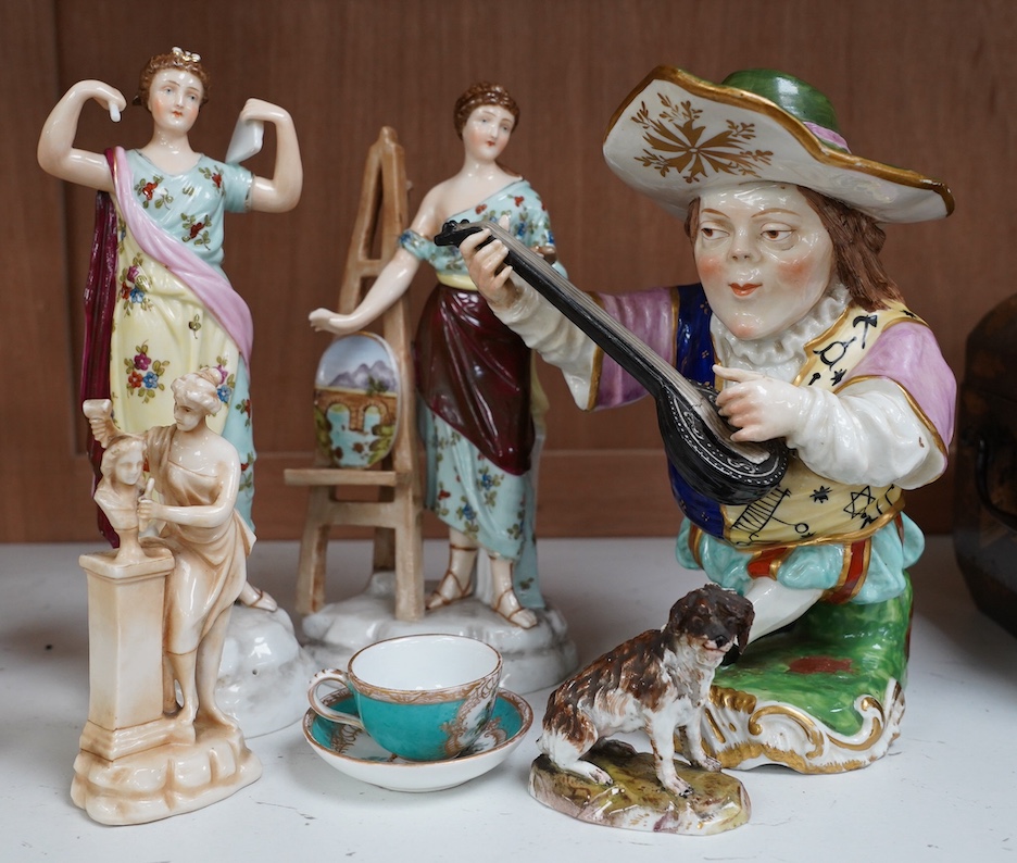 A 19th century French Mansion House Dwarf, a pair of Volkstedt figures, a Meissen dog, cup and saucer and a German porcelain female sculpture, tallest 21cm. Condition - fair to good, a few minor chips